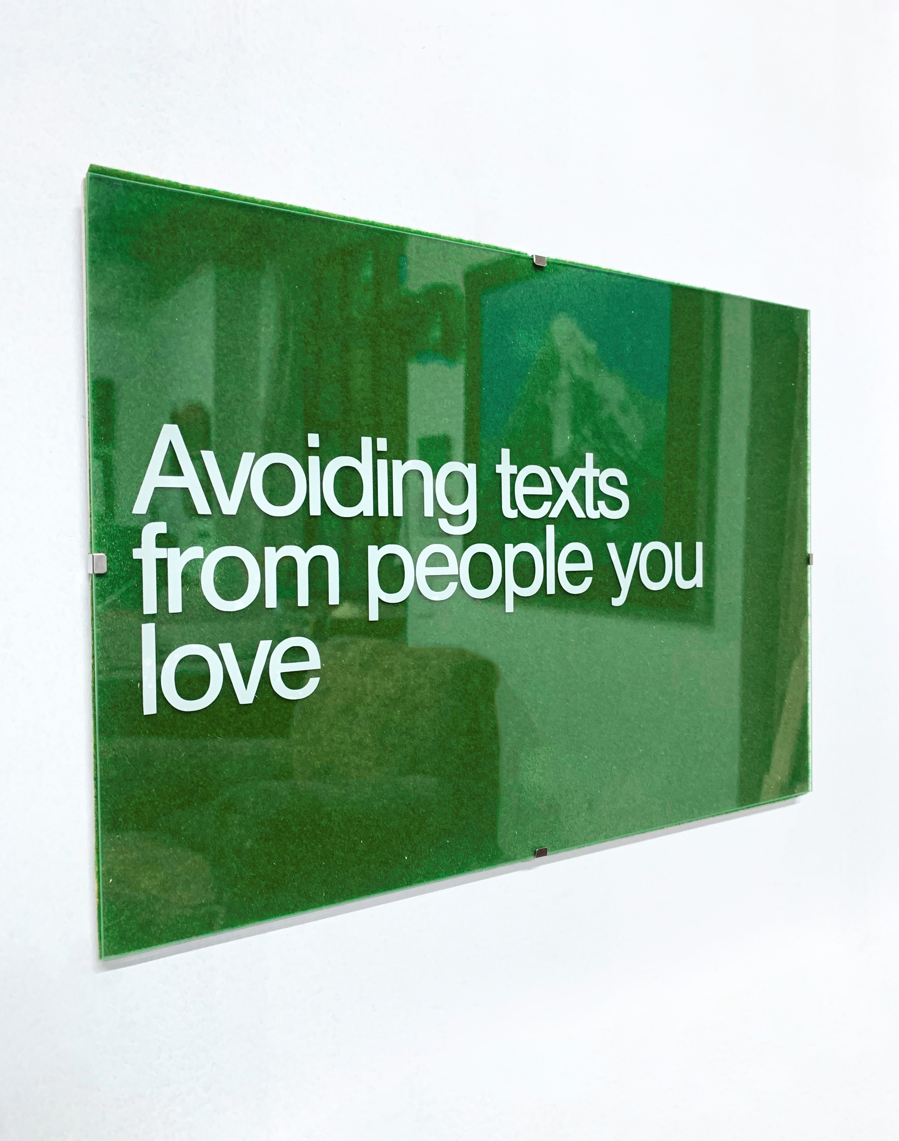 Avoiding Texts From People You Love, 2025, vinyl on glass and imitation grass, by Bryony Hillman