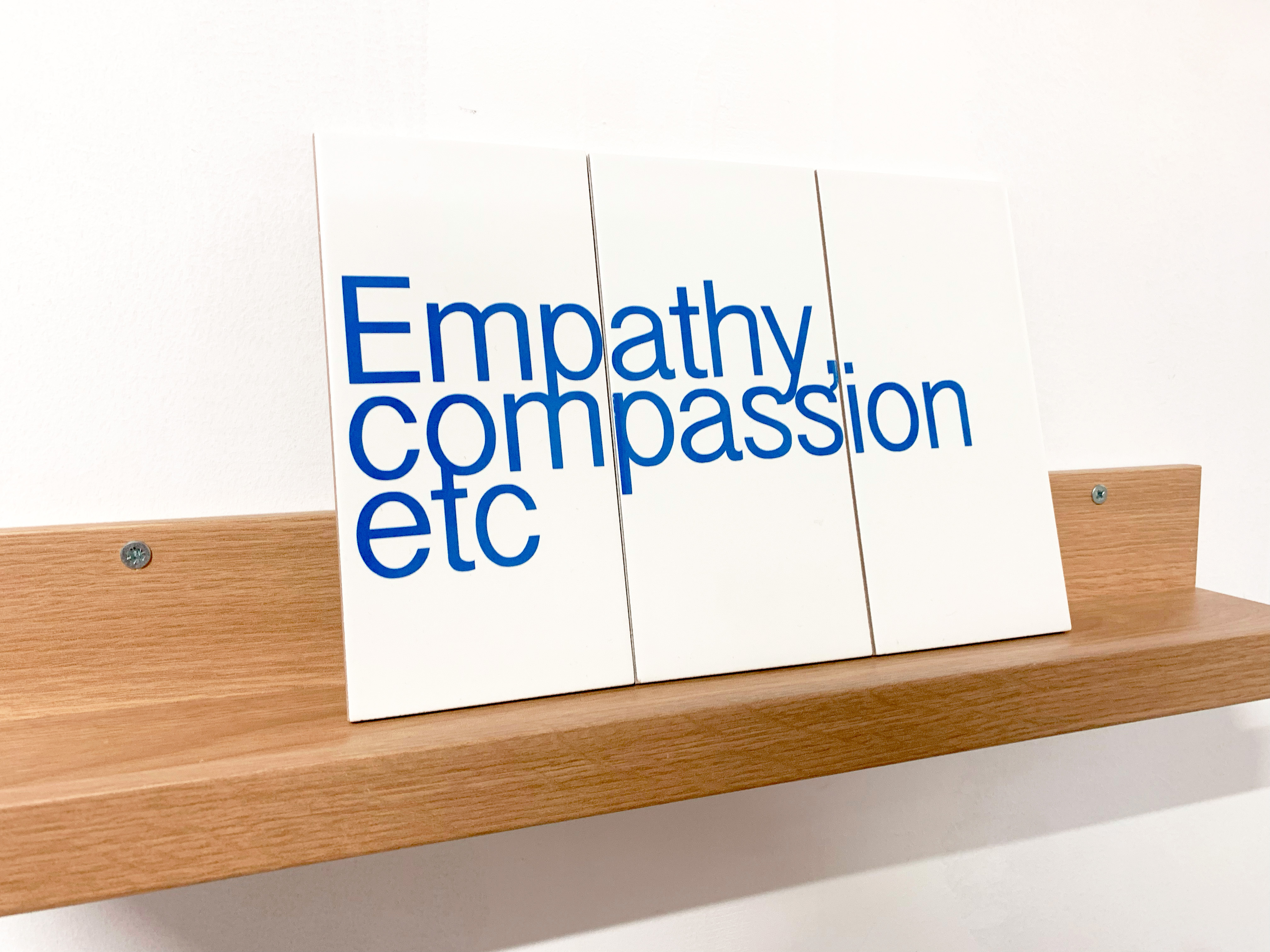 Empathy, Compassion, etc, 2025, vinyl on ceramic tile by Bryony Hillman